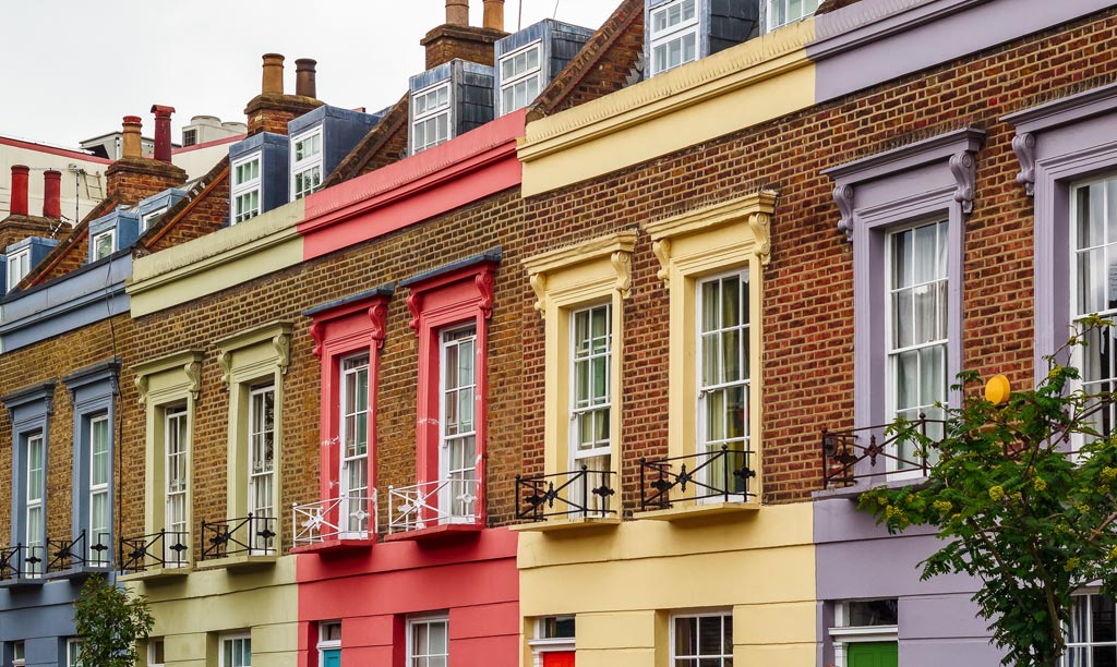 A row of colourful town houses all painted different colours