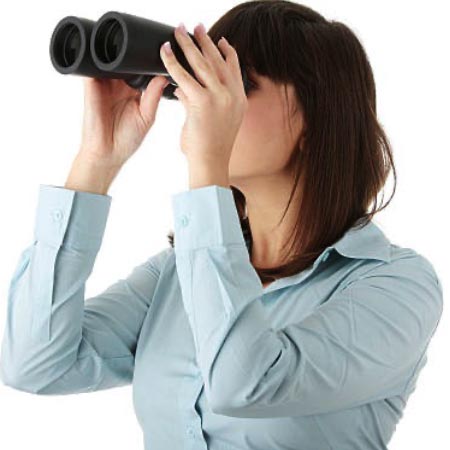 A person looking through binoculars